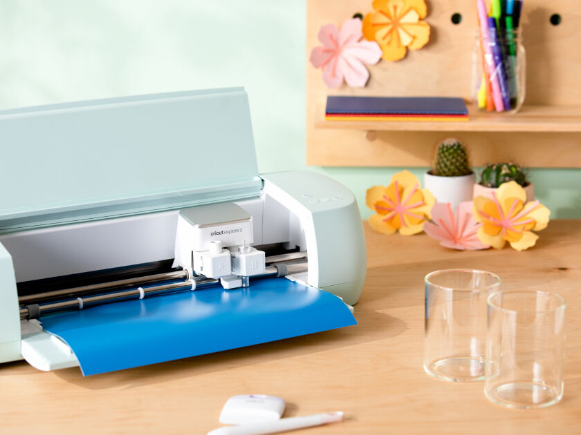 Cricut Explore 3 smart cutting machine cutting blue vinyl